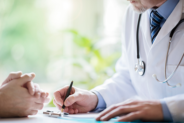 doctor and patient reviewing charts