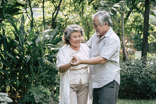 elderly couple dancing on holiday