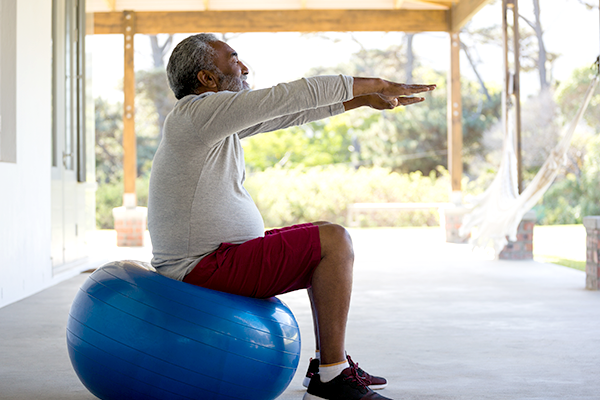 senior man exercising on patio